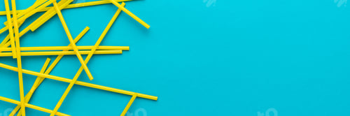 Preview: Top View of Cocktail Straws on Turquoise Blue Background with Copy Space