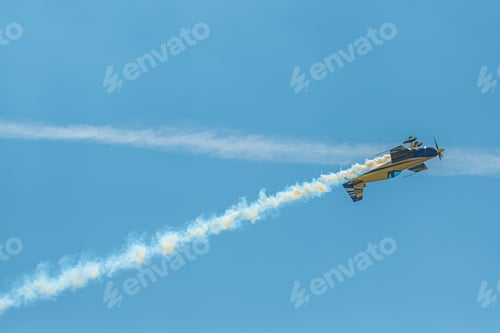 Preview: The aerobatic plane with smoke track in the sky
