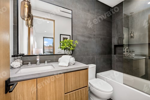 Preview: Sleek modern bathroom with glass shower and wooden cabinets