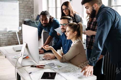Preview: Young architects working on project in office