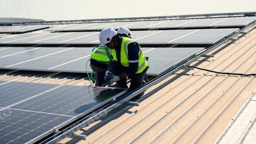 Preview: Engineers with safety helmet checking solar system at solar power farm