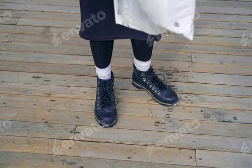 Preview: Unrecognizable Young Woman'S Feet In White High Socks And Black Boots. Girl Walking In The City.