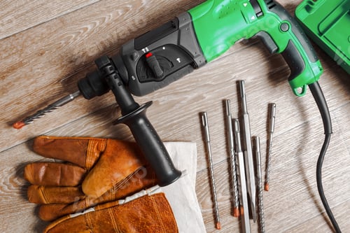 Preview: Drill and Bits on Wooden Plank Background