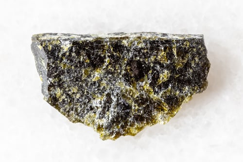 Preview: sample of raw diopside rock on white marble