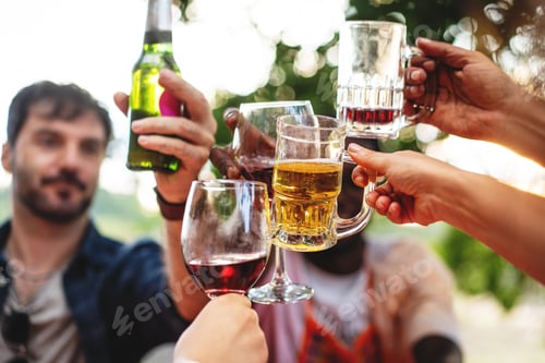 Preview: Diverse friends toasting with various drinks, outdoor social gathering celebration