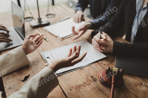 Preview: Business people negotiating a contract, discussing contract while working together in sunny modern o