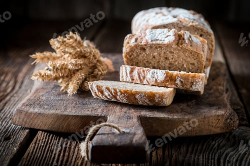 Preview: Tasty and fresh bread with grains on wooden table