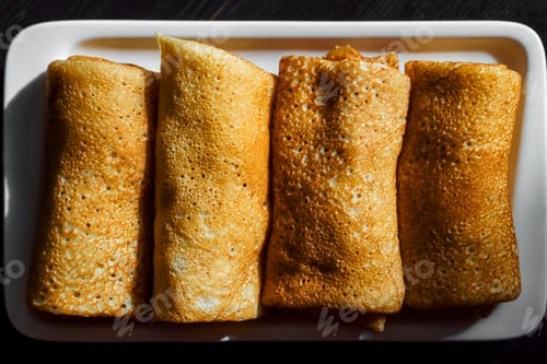 Preview: Top view of filled pancakes, traditional baked goods for Christian Orthodox holidays