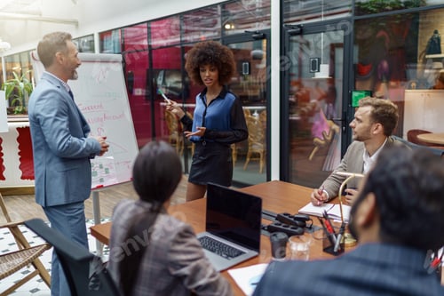 Preview: A group of business people partners during a set team meeting in the modern office