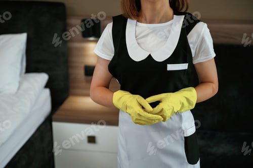 Preview: Young chambermaid is in hotel room