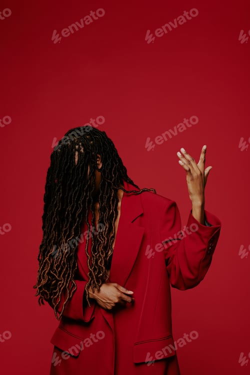 Preview: African American Woman in Red Suit Posing Stylishly