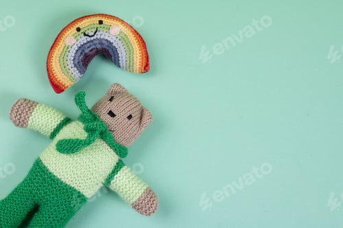 Preview: Soft toys next to rainbows and thread clouds where it rains, toy world