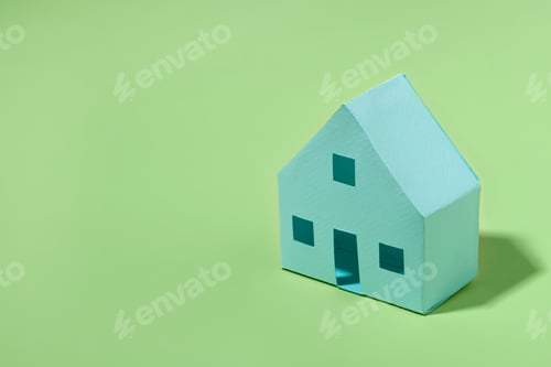 Preview: Green model house on a matching background for eco housing