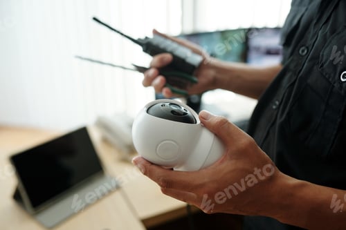 Preview: Guard Holding Surveillance Equipment