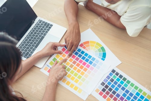 Preview: Interior designer team partner engineer brainstorming choosing color swatch