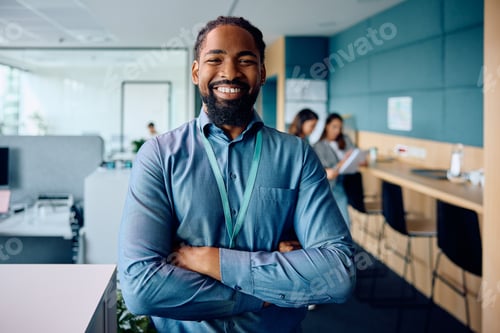 Preview: Portrait of confident black businessman in the office looking at camera.