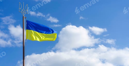 Preview: Ukraine flag waving over blue sky with white clouds background with copy space