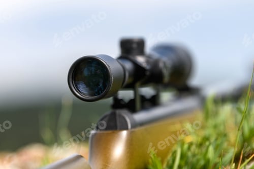 Preview: Rifle scope on the street with blurry background. Hunting concept