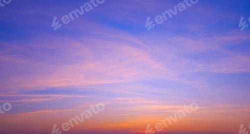 Preview: Colorful sunset sky in the evening with orange sunlight clouds on idyllic horizontal sky background