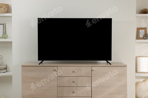Preview: Stylish wide TV set on wooden cabinet in room