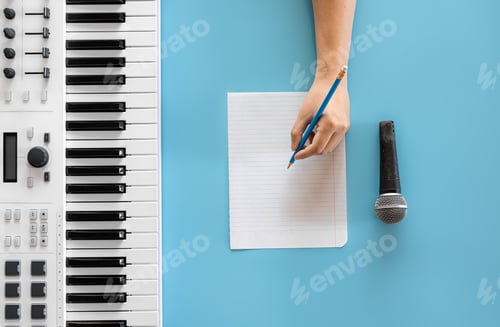 Preview: Musical keys, microphone and blank paper on a blue background.