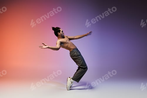 Preview: African american man dancing on colorful gradient