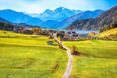 Preview: Magnificent autumn view of St.Valentin village and Haidersee (Lago della Muta) lake with Ortler peak