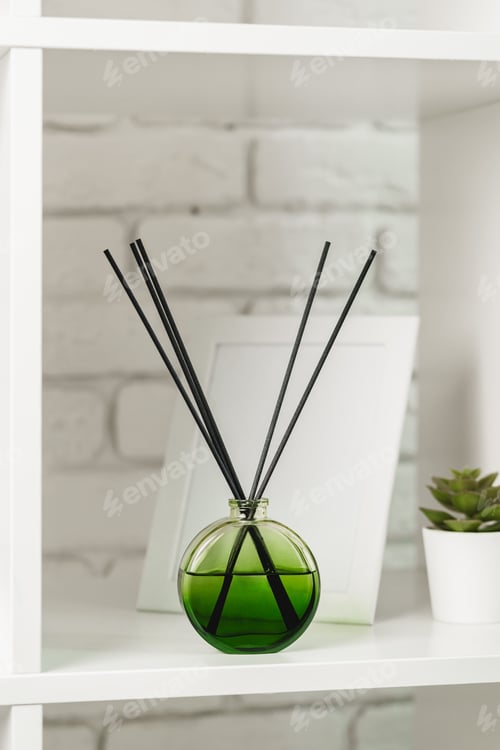 Preview: Elegant Reed Diffuser on White Shelf in a Modern Minimalist Interior Setting