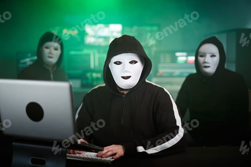 Preview: Masked Hacker is Using Computer for Organizing Massive Data Breach Attack on Corporate Servers.