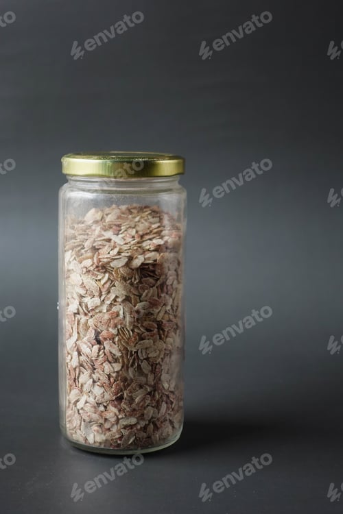 Preview: red Flattened rice in a jar on table