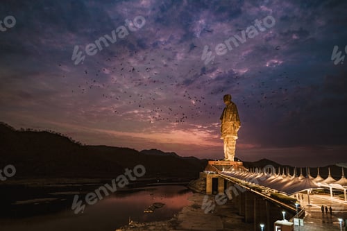 Preview: Beautiful shot of a statue of Unity in India against a cloudy sky at sunset