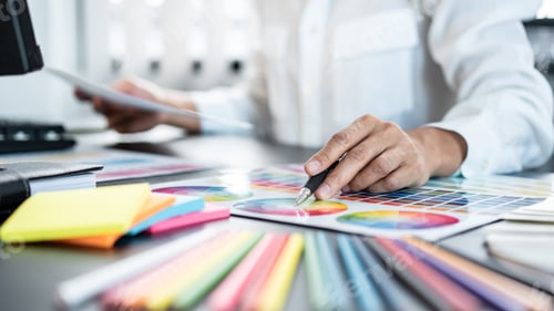 Preview: Young creative graphic designer working on color selection and d