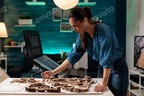 Preview: Professional architect standing at maquette table