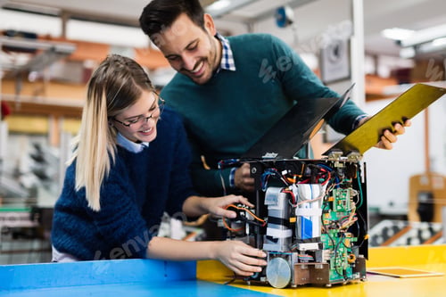 Preview: Young students of robotics working on project