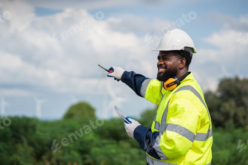 Preview: Service engineers checking system of windmill. Wind turbines generate electricity.