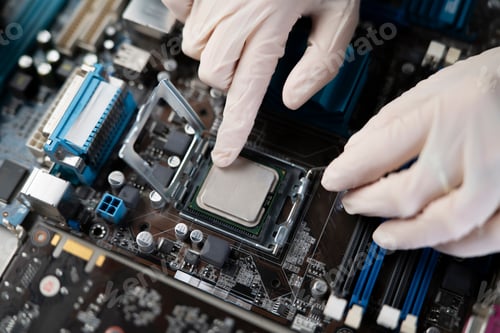Preview: s hand insert processor cpu chip in the socket of motherboard, computer assembly process