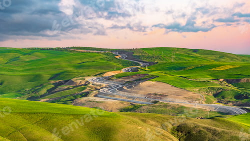 Preview: Winding road through the pass landscape
