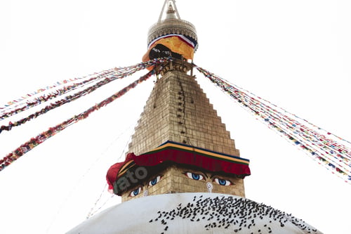 Preview: Closeup shot of strings attached to the top of the temple with a white sky in the background