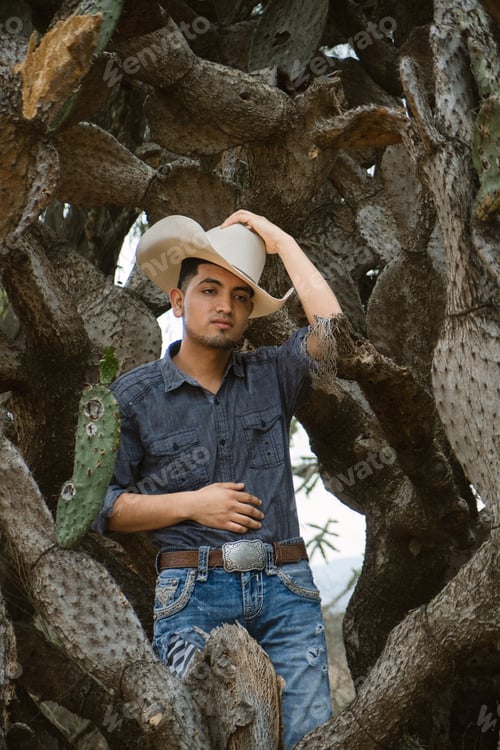 Preview: Smiling cowboy wearing a hat and sunglasses, enjoying outdoor adventures with a sense of fun