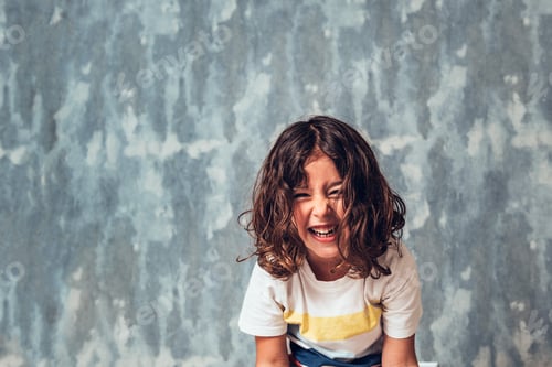 Preview: portrait of a little girl laughing out loud