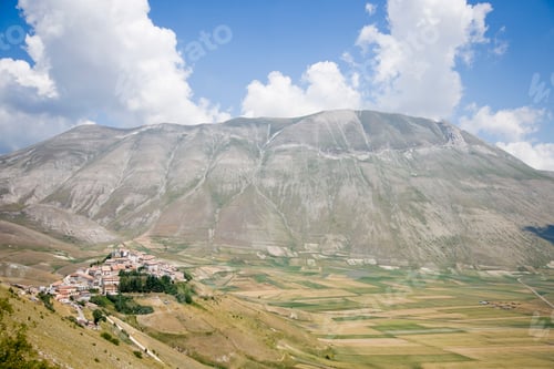 Preview: Hilltop Town With Mountain in Background
