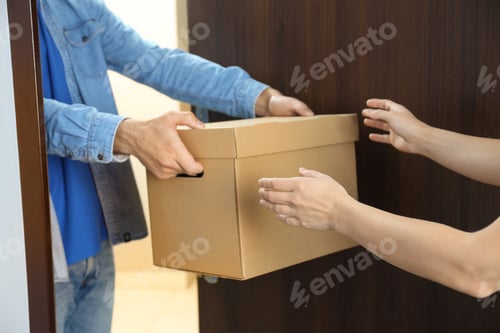 Preview: Delivery man gives a box of food to a woman