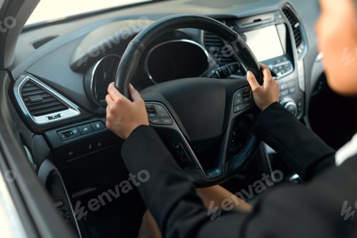Preview: Woman sitting in a car