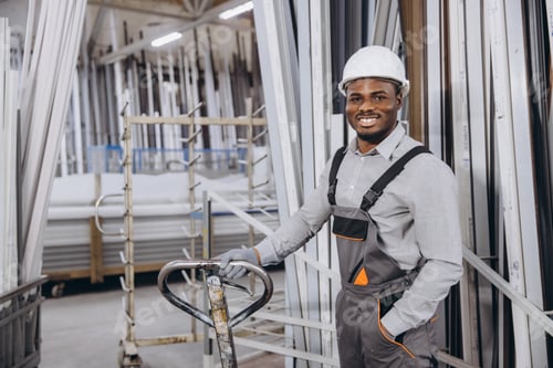 Preview: Factory worker transporting aluminum and pvc window and door frames