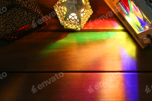 Preview: Decorative Arabic lanterns on wooden table, flat lay. Space for text
