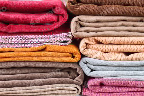 Preview: Colorful Stacks of Folded Fabrics Background