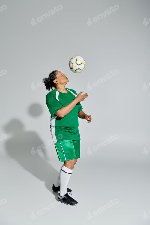 Preview: Athletic Woman Juggling Soccer Ball in Studio