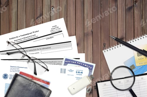 Preview: USCIS form I-129 Petition for a nonimmigrant worker lies on flat lay office table and ready to fill