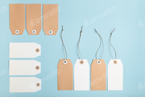 Preview: Set of ten blank paper price tag with a knotted string on a blue background