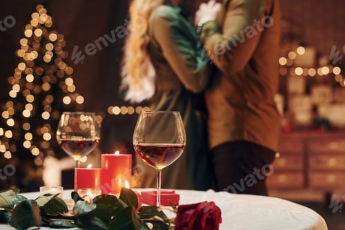 Preview: Standing and dancing. Young lovely couple have romantic dinner indoors together